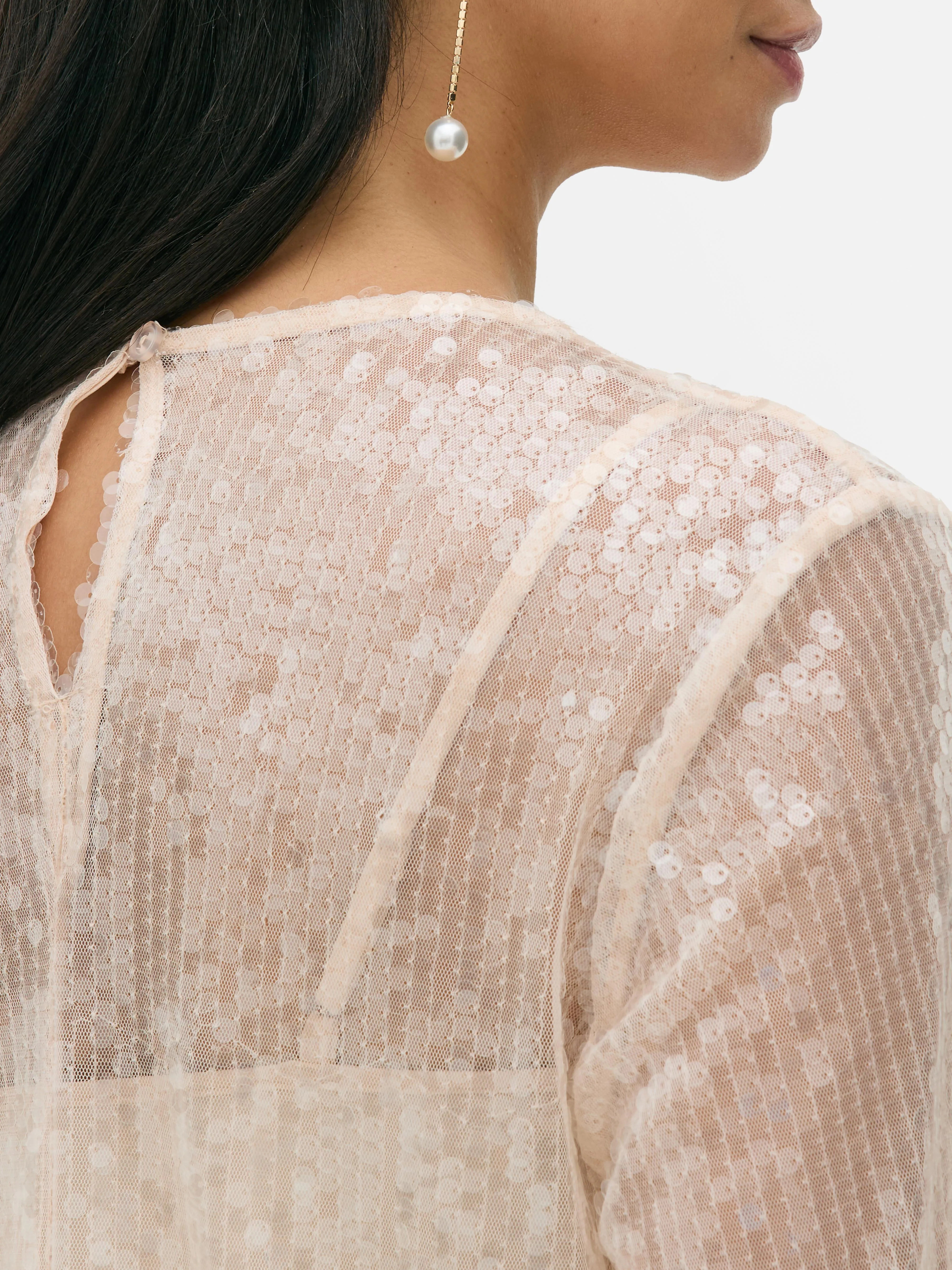 Blusa de lentejuelas con mangas globo